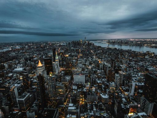 Stunning aerial view of New York City's skyscrapers and skyline at dusk, showcasing the urban landscape.